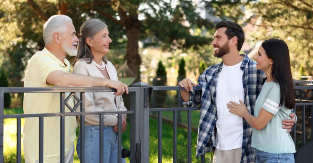 neighbors greeting each other at the backyard